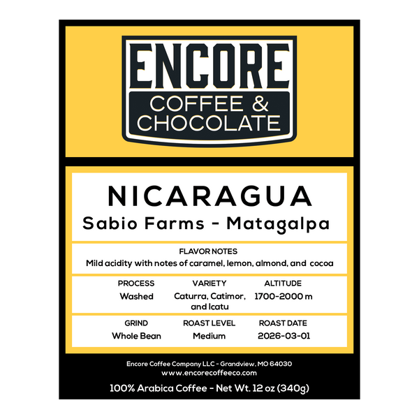 Encore Coffee & Chocolate Nicaragua Sabio Farms Matagalpa coffee label showing caramel, lemon, almond, and cocoa flavor notes, medium roast, washed process.