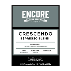 A blue / grey background with the Encore logo. The label featuring the words "Crescendo - Espresso Blend" in bold font. Below the title is a description of the coffee, and at the bottom are the weight measurements.