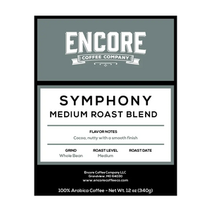 A blue / grey background with the Encore logo. The label featuring the words "Symphony - Medium Roast Blend" in bold font. Below the title is a description of the coffee, and at the bottom are the weight measurements.