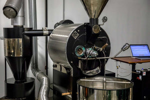 Industrial coffee roaster at Encore Coffee & Chocolate used for small-batch roasting in Kansas City.