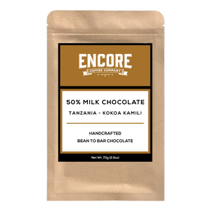 An image of a 50% Milk Chocolate bar from Tanzania, produced by Encore Coffee Company. The chocolate bar is wrapped in a light brown paper packaging, with the company logo and product name displayed prominently on the front. The chocolate itself is a smooth, glossy brown, with small pieces and swirls visible on the surface.