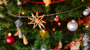 Image of Christmas tree with multiple ornaments of various colors