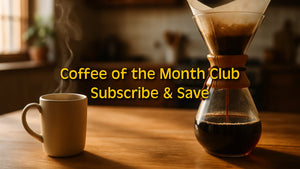 Steaming ceramic mug and Chemex pour-over on a wooden table in a sunlit kitchen – Coffee of the Month Club promo from Encore Coffee.