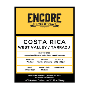 A yellow background with the Encore logo.  The label featuring the words "Costa Rica West Valley / Tarrazu" in bold font. Below the title is a description of the coffee, and at the bottom are the weight measurements.