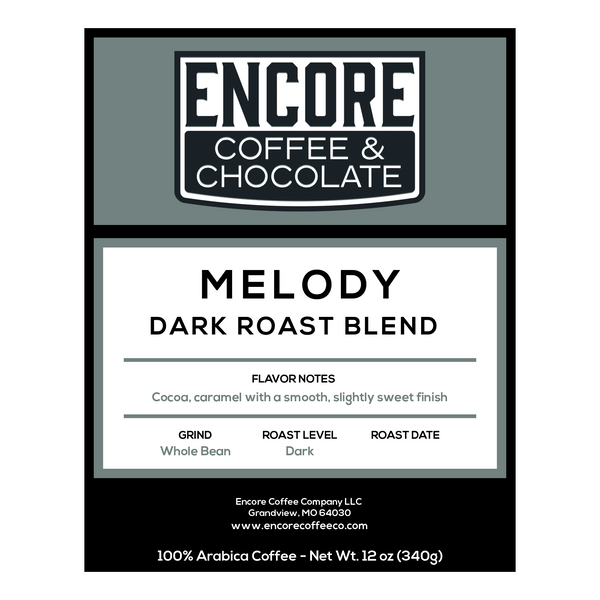 Encore Coffee & Chocolate Melody dark roast blend label featuring flavor notes of cocoa and caramel with a smooth, slightly sweet finish.