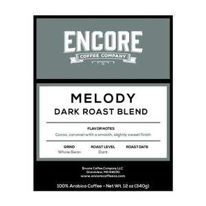 A blue / grey background with the Encore logo. The label featuring the words "Melody - Dark Roast Blend" in bold font. Below the title is a description of the coffee, and at the bottom are the weight measurements.