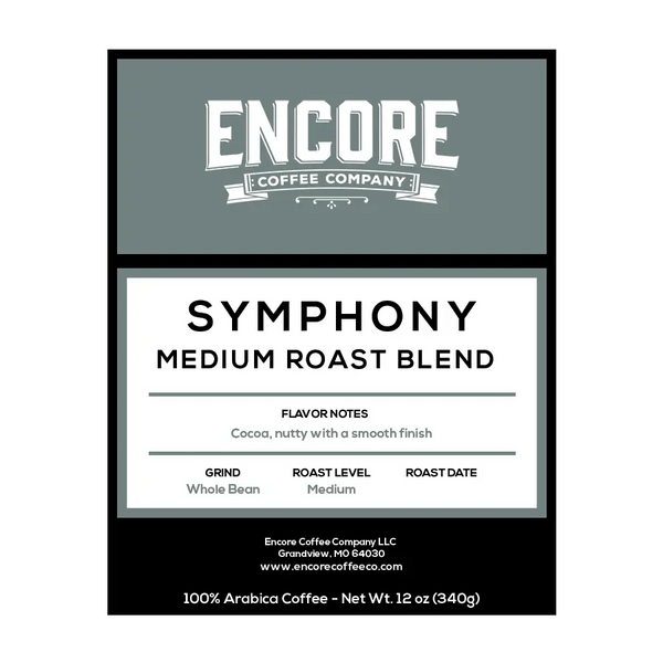 A blue / grey background with the Encore logo. The label featuring the words "Symphony - Medium Roast Blend" in bold font. Below the title is a description of the coffee, and at the bottom are the weight measurements.