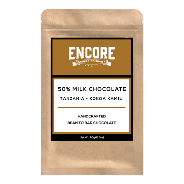 An image of a 50% Milk Chocolate bar from Tanzania, produced by Encore Coffee Company. The chocolate bar is wrapped in a light brown paper packaging, with the company logo and product name displayed prominently on the front. The chocolate itself is a smooth, glossy brown, with small pieces and swirls visible on the surface.