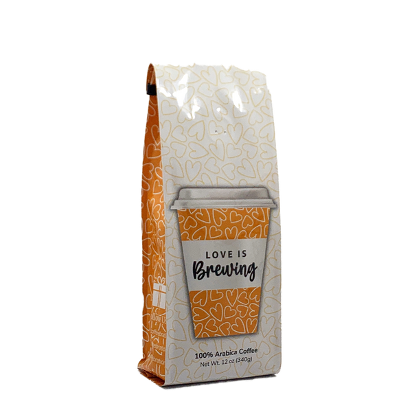 Side View of Bag – Love is Brewing. Our coffee gift is freshly roasted in small batches.